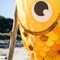 In the Breeze 5244 — 40-inch Gold Shimmer Damsel Fish — Large, Colorful Printed Fishsock with Iridescent Details
